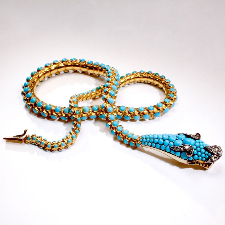 Victorian 19th century turquoise and gold snake necklace.  Fully articulated snake with hundreds of bezel set cabochon turquoise beads mounted in 18 karat gold.  Finely detailed snake head completely encrusted with turquoise beads and crowned with