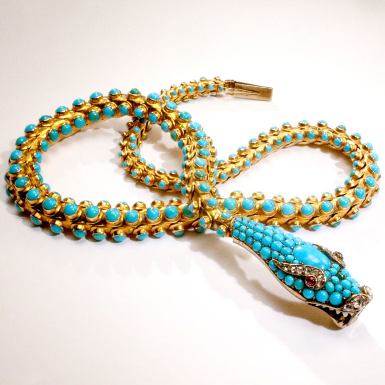 Victorian19th century turquoise and gold snake necklace.  Fully articulated snake with hundreds of bezel set cabochon turquoise beads mounted in 18 karat gold.  Finely detailed snake head completely encrusted with turquoise beads crowned with larger