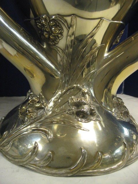 A Fantastic, Art Nouveau 3 Handled Centerpiece / Vase / Trophy. The Domed Base Applied With Sprays Of Daffodils, The Curving Horn-Shaped Handles Topped By Further Sprays Of Jonquils And Iris. Amazing Detail, Design & Condition. Stands At 21