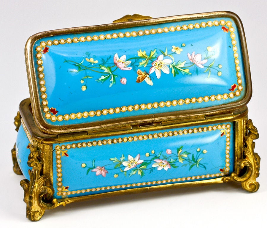 Oh how I love it when I get the blues! Celeste or 'Sevres' blue, I mean. And you can easily see the reason - here is one more of those fabulous old mid-1800s French kiln-fired enamel jewelry caskets in its elegant old ormolu framework with ornate