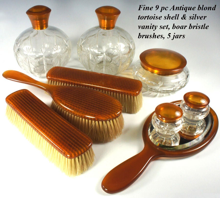 A Fine Edwardian to Victorian vanity set comprised of 10 items (title says 9, but a second hair brush will be included which has a repair to handle). The set is a stunning example of fine amber-colored blond tortoise shell of finest quality. The