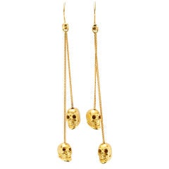 A Pair of Gold Skull Ear Pendants