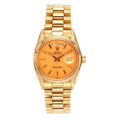 ROLEX A Yellow Gold Pink "Stella" Dial Day-Date Wristwatch