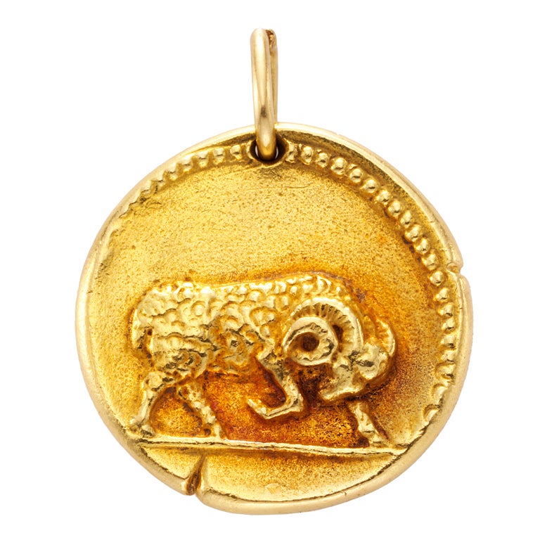 VAN CLEEF & ARPELS A Gold 'Taurus' Zodiac Pendant