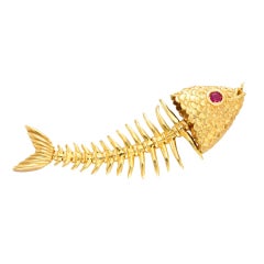 TIFFANY & CO. A Ruby and Gold 'Fish' Pendant