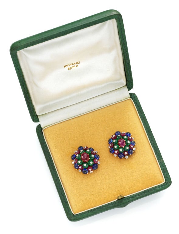 Bulgari, A Pair of Emerald, Sapphire, Ruby and Diamond Ear clips, each designed as a circular plaque cluster, set with cabochon sapphires, rubies and emeralds, accented by circular-cut diamonds, mounted in yellow and white gold, signed Bulgari,