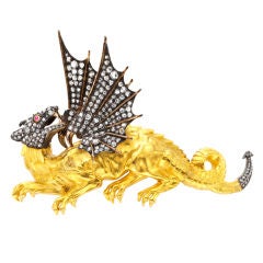 A Diamond and Gold Dragon Brooch Mounted in Silver