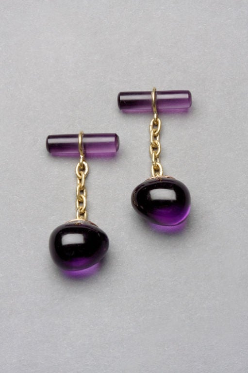 Based on a Fabergé design from 1880 by the firm's head workmaster, Erik Kollin, the well-matched deep violet amethysts recall the finest Siberian specimens of the 19th century. Each egg and amethyst bar link is hand polished and joined together by a