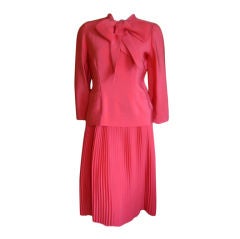 Norell two piece suit with knife pleat skirt & pussycat bow