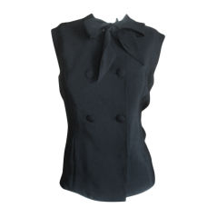 Black silk double breasted top with bow by Norman Norell