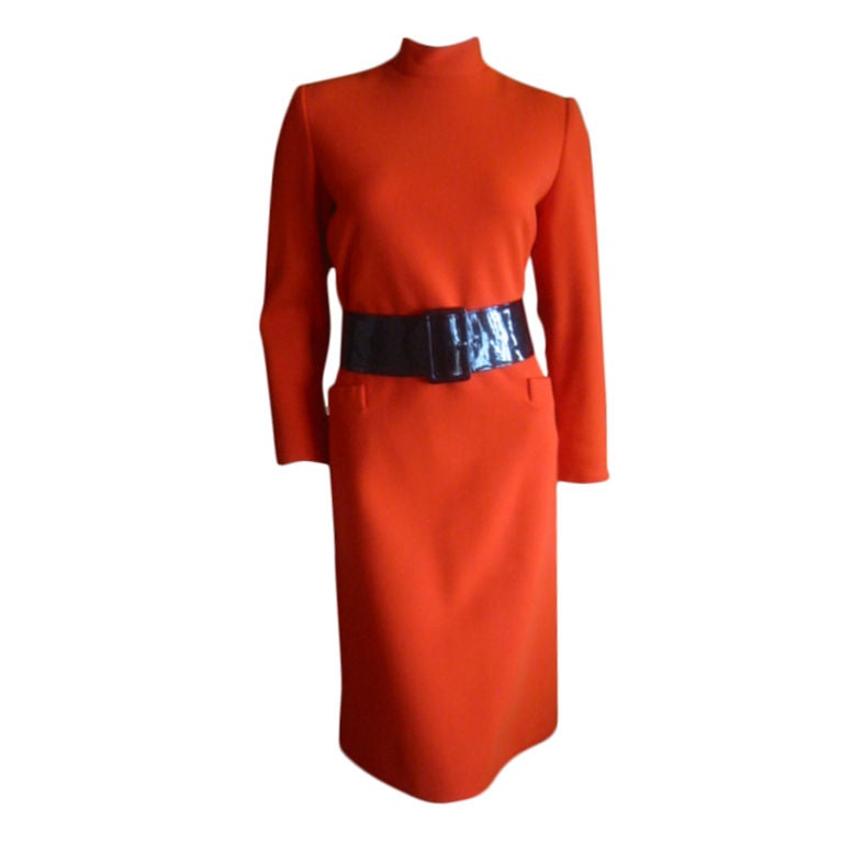 Orange  dress with wide patent leather belt from Norman Norell