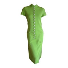 Retro Norman Norell neon green dress with bold buttons