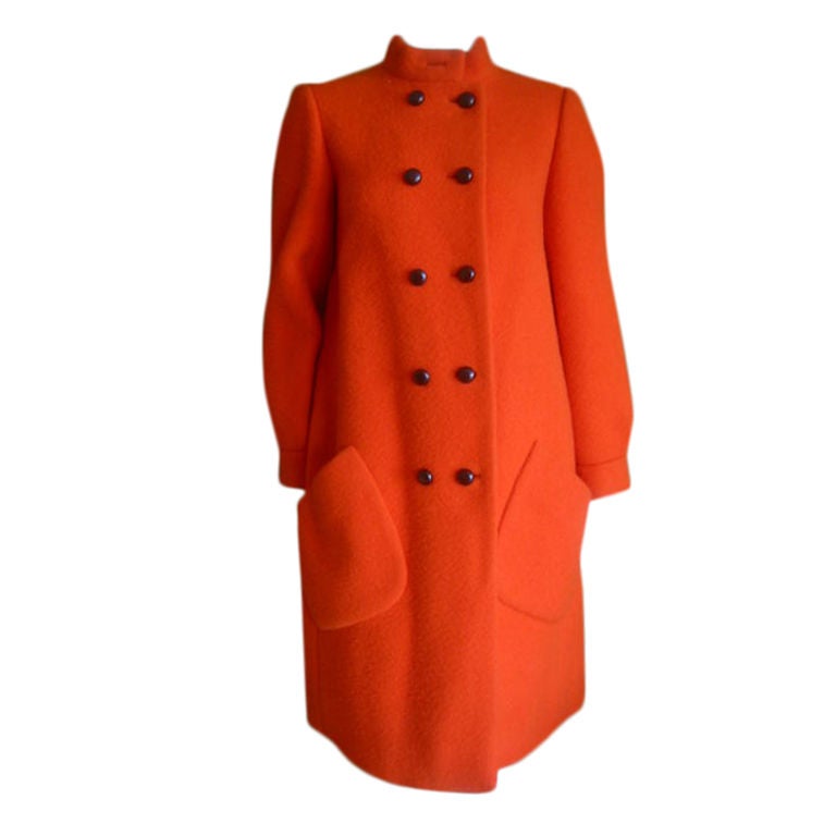 Bold wool coat in day glo orange, from Norman Norell.<br />
<br />
Bust 40