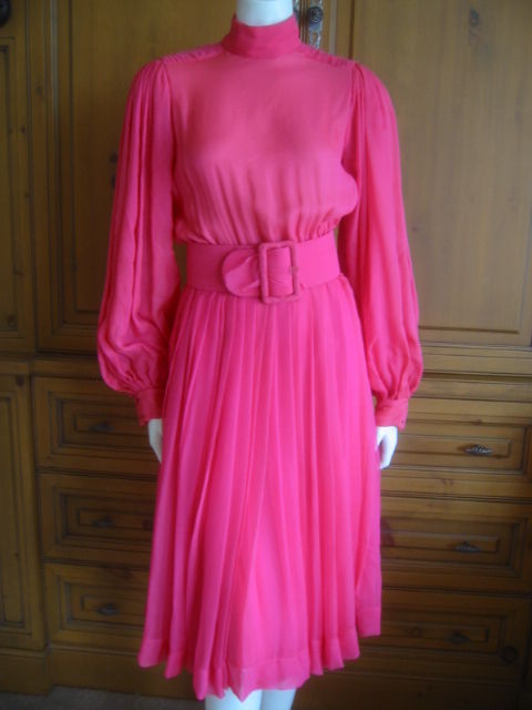 Dreamy silk chiffon dress with poet sleeves from Norman Norell.<br />
Softly elegant, this delicate fabric has some issues, most evident around the belt buckle.<br />
Very Edith Beale<br />
<br />
Bust 38