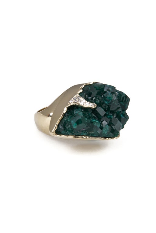 KARA ROSS - A real show stopper. This ring is part of the designer's raw series in which she highlights the natural characteristics of the stones as the exist in nature. The hand crafted 18k gold setting highlights the irregular nature of the stone.
