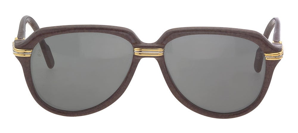 Classic vintage Cartier Vitesse sunglasses in brown and signature gold/silver hardware. Signed Cartier Paris Made in France. 
