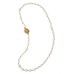 CHANEL LONG PEARL NECKLACE WITH CC COIN