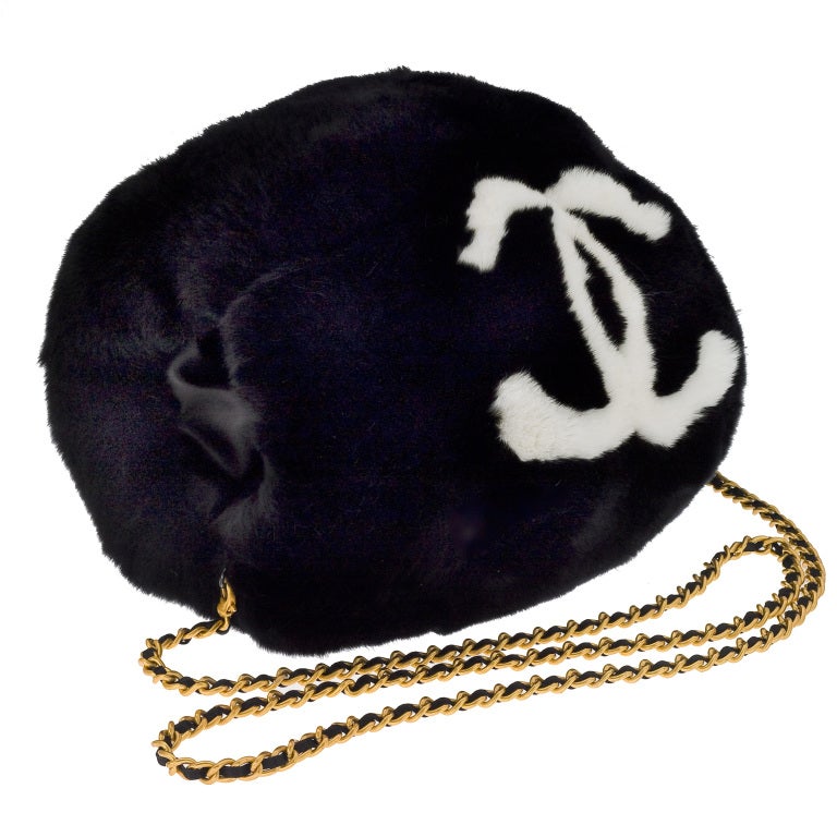Vintage Chanel large handmuff with white and gold chain.