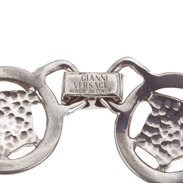 Gianni Versace silver toned bracelet with Medusa motifs.