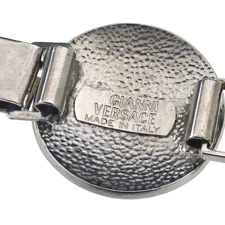 Gianni Versace massive silver toned medallion bracelet with iconic Medusa motifs.