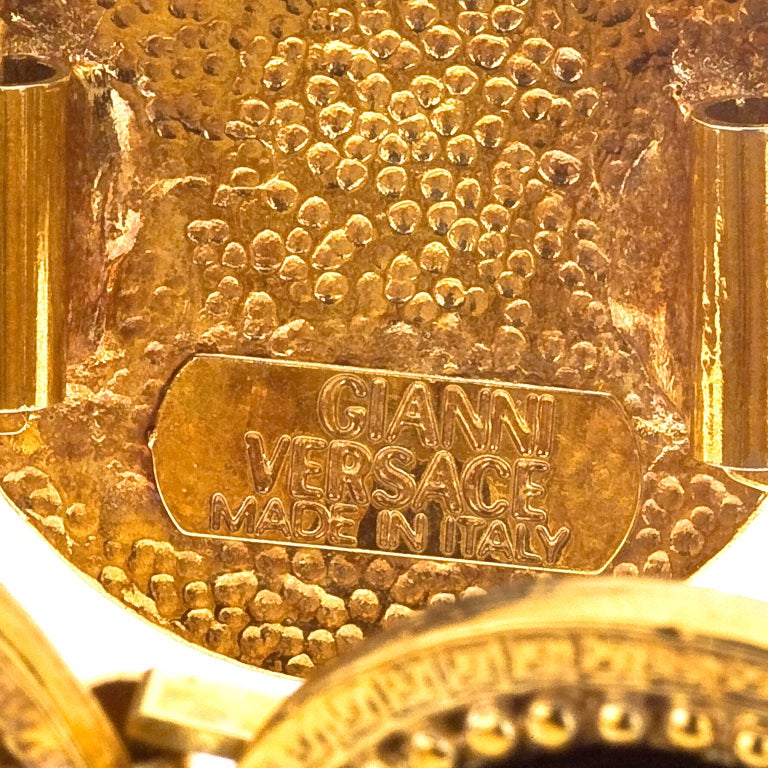 Gianni Versace massive black and gold bracelet with 5 iconic Medusa motifs.