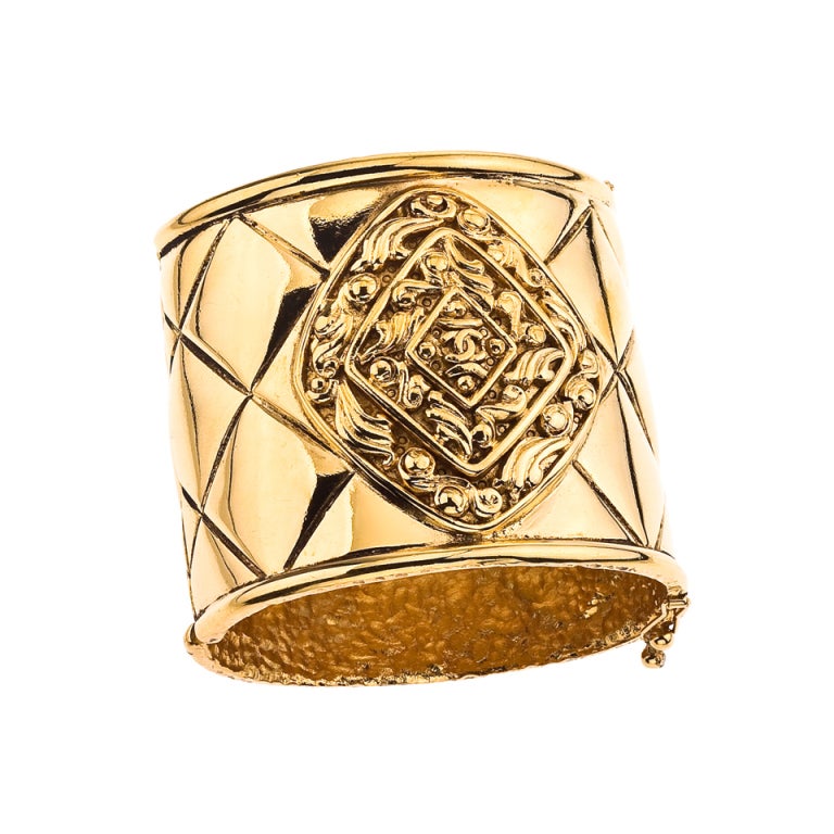 CHANEL MASSIVE GOLD TONED BANGLE WITH QUILTED DETAILS