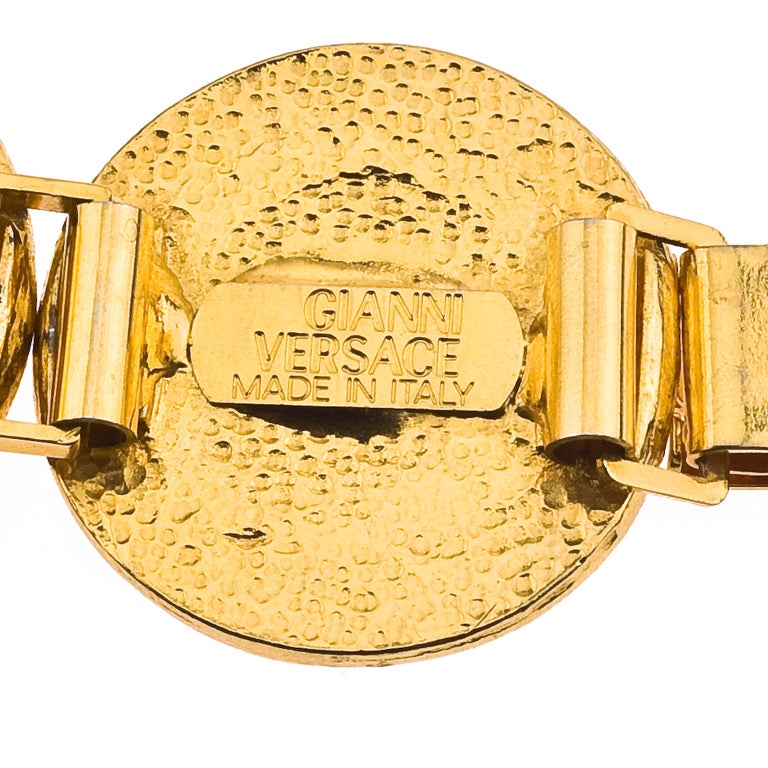 Beautiful, very rare Gianni Versace red and gold bracelet with iconic Medusa motifs.