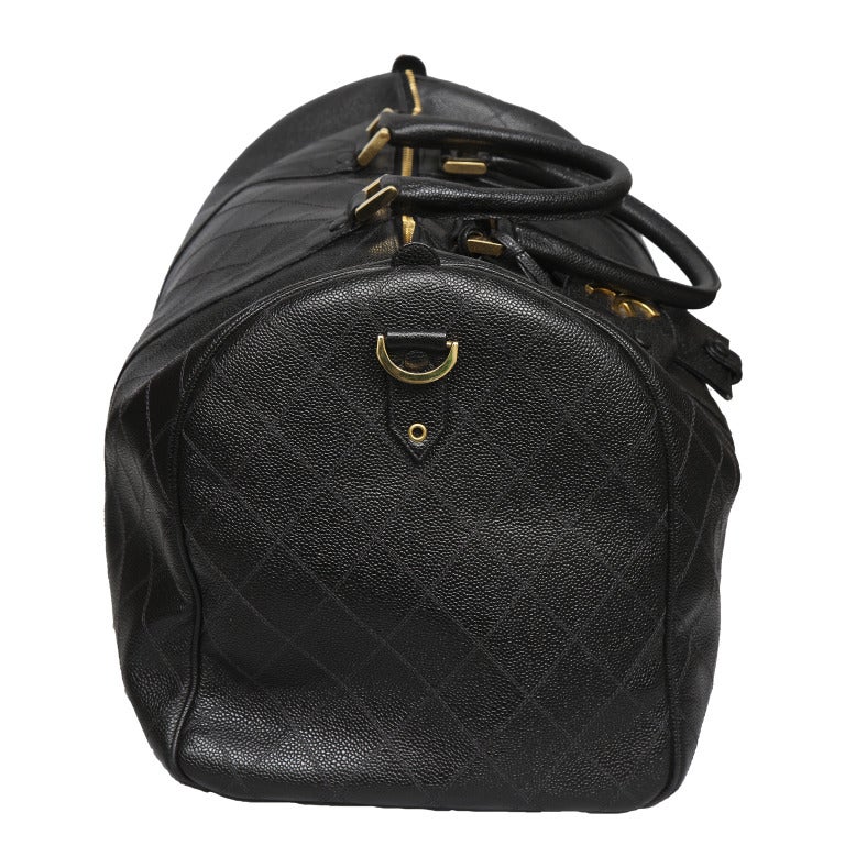 Vintage Chanel Large Quilted Duffle Bag with caviar skin leather.


Specifications: Height: 15, Width: 19.5, Depth 10 inches
Handle Drop: 5.5 inches