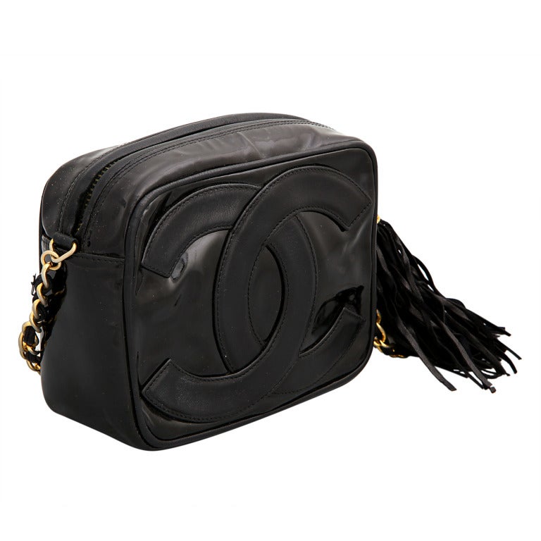 Chanel patent leather bag with tassel in black.