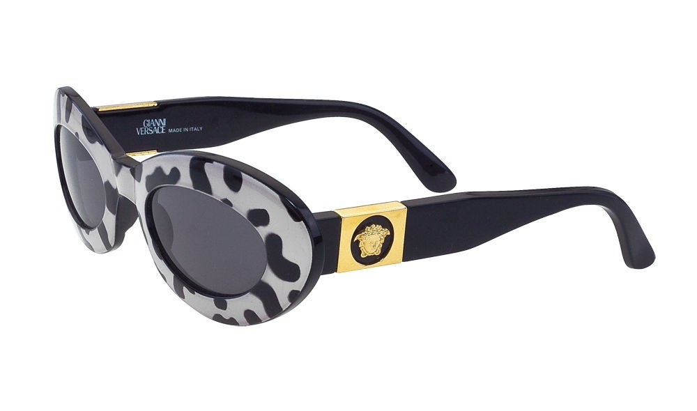 Very cool Gianni Versace sunglasses with Dalmatian print and gold medusa on the sides.

