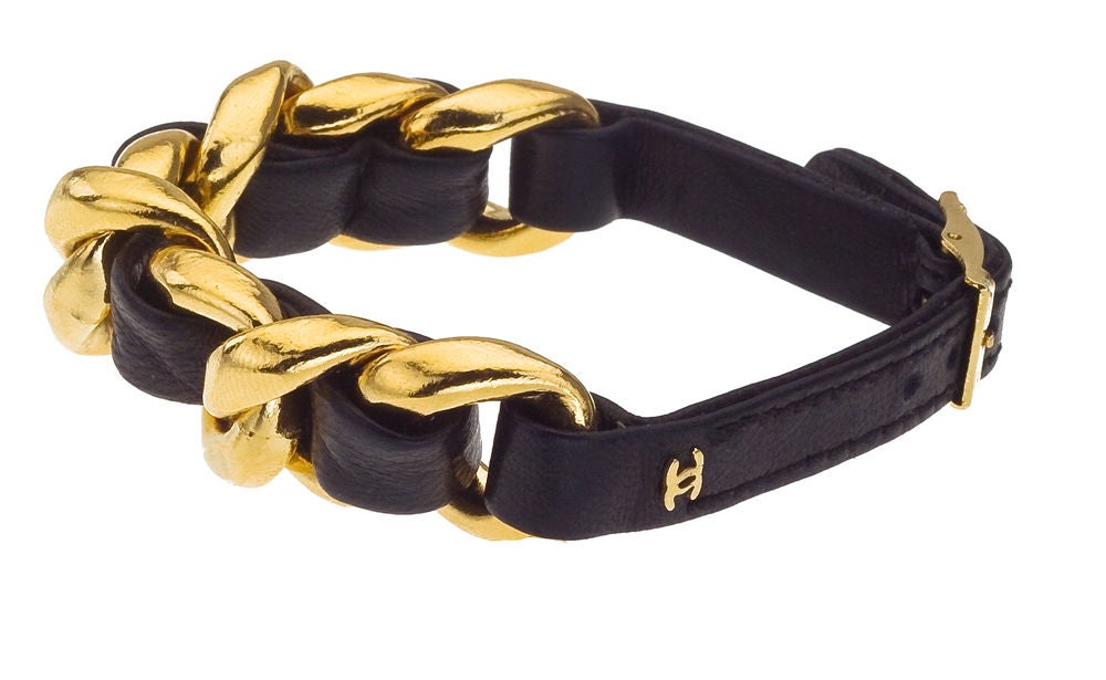 Chanel black/gold chain bracelet with CC logo.