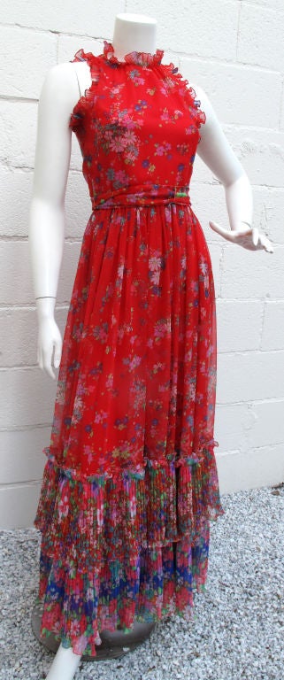 Radient Red 1970s Floral Maxi Dress with ruffled sleeves & neck<br />
<br />
2 tiered sheer skirt & matching belt<br />
<br />
Please call or email with any questions!