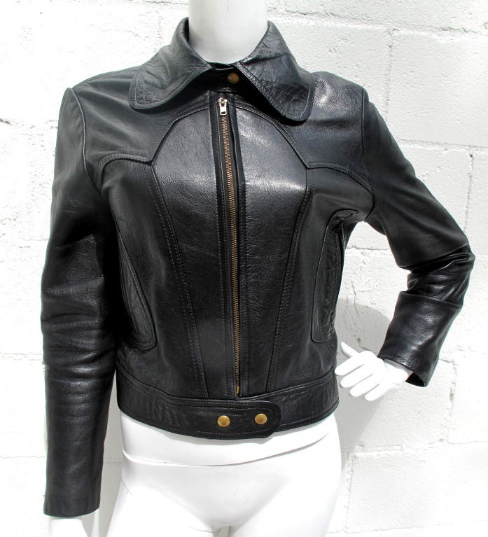 Mint 1970s black leather zip front jacket. This jacket is NOT lined. This helps to create a form hugging fit. Brass zipper and snap closure. The jacket had a rounded tip fly collar. Just right to channel 