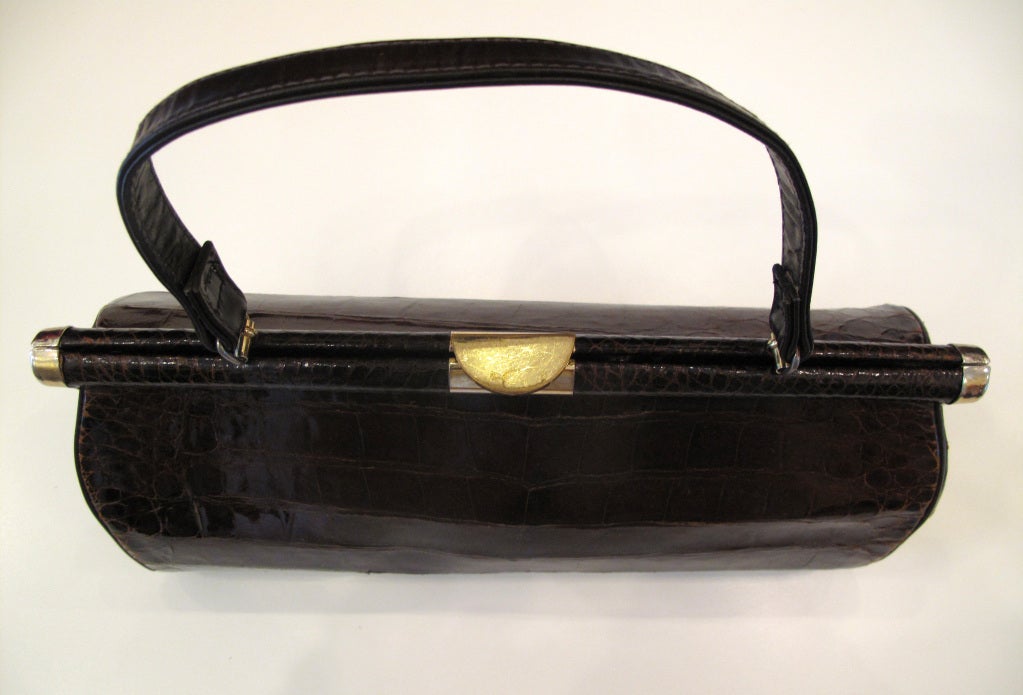 Please contact dealer prior to purchase for White Glove shipping options.

Ladylike BELLESTONE Long Alligator Purse in Chocolate Brown

Large rectangular scales on front, gold hardware, some wear.

Please don't hesitate to contact with any