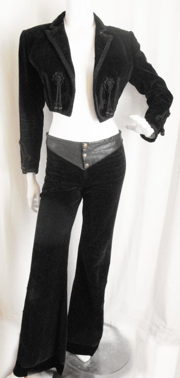 Please contact dealer prior to purchase for White Glove shipping options.

Rock Out in this AMAZING 2pc Blk Velour & Leather Bolero Pant Suit. Exquisit detailing on the jacket and pants in leather and embroidered trimming. Tassels on the front and