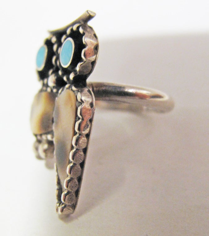 PAUL LUCARIO NATIVE AMERICAN ARTIST OWL INLAY RING with Turquoise eyes and Spotted Jasper or Cowry Shell Body. The Artist Paul Lucario was from  Laguna Pueblo.