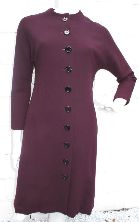Please contact dealer prior to purchase for White Glove shipping options.

GUSTAVE TASSELL long sleeve dress, very Jackie O. The photos don't give justice to the deep saturated plum color of this dress. Lace inside hem and optional sash pictured
