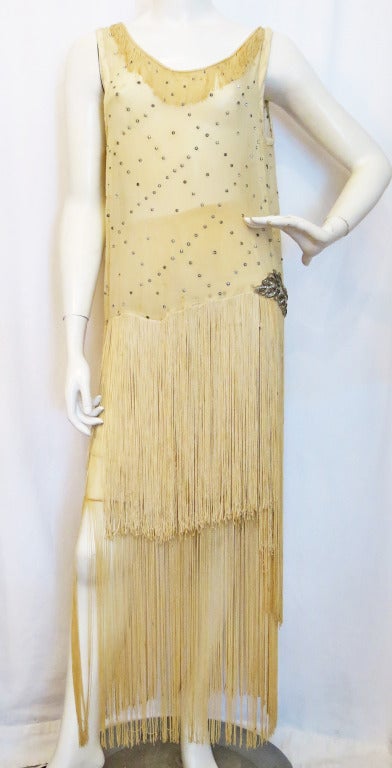 Please contact dealer prior to purchase for White Glove shipping options.

1920s Flapper Fringe Dress with Rhinestones. There are two pieces. A silk skirt with fringe and top/dress with fringe overlay. Stunning!