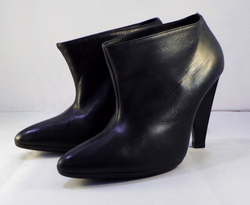 Please contact dealer prior to purchase for White Glove shipping options.

Balenciaga Black Ankle Boots. Just under a 4' heel. 5.5