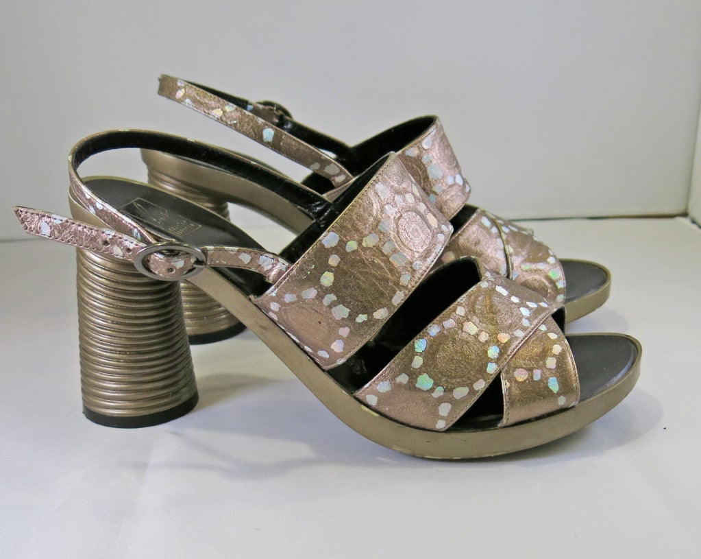 Please contact dealer prior to purchase for White Glove shipping options.

Charles Jourdan Bis Holographic Platform Sandals. Soles are free from wear. Marked a size 8. Fits like a 7.5