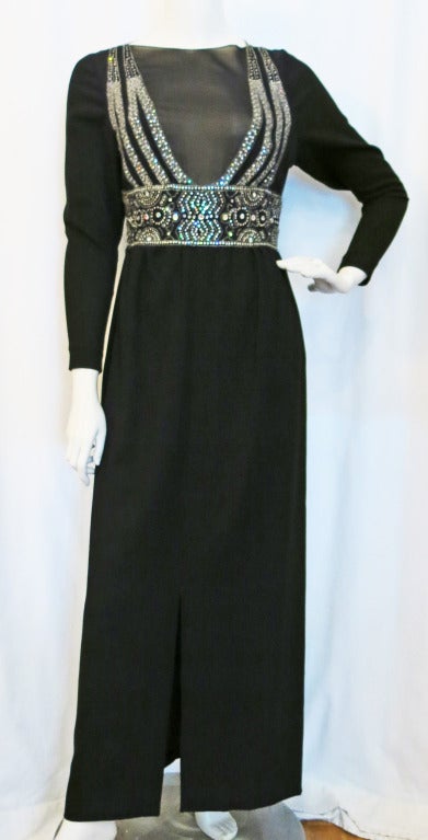 Please contact dealer prior to purchase for White Glove shipping options.

Pauline Trigere Black Beaded and Rhinestone Gown w Sheer Deep V Front. Unbelievably gorgeous! Excellent Condition