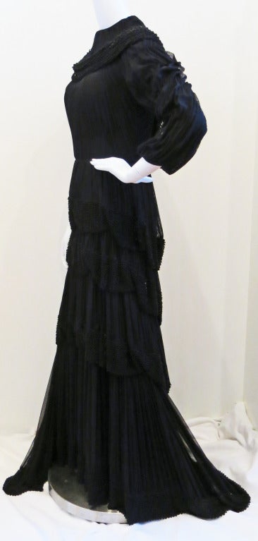 Please contact dealer prior to purchase for White Glove shipping options.

Cachet Black Beaded Layered Goth Gown 

Pictures don't capture the unique beauty and detailing of this gown. It's exquisite.