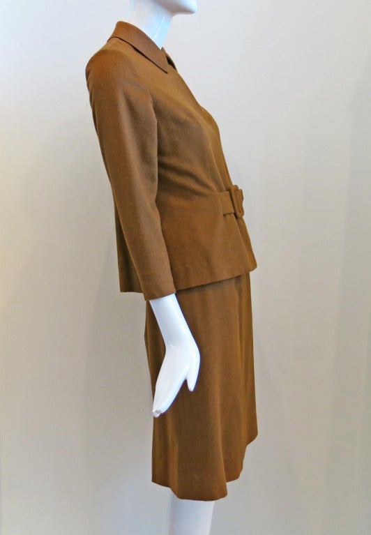 1960s Brown Vicuña Wool Skirt Suit Set

Please contact dealer prior to purchase for White Glove shipping options.

Measurements (taken while lying flat):

Jacket
Shoulder to shoulder - 15"
Armpit to armpit - 16"
Waist -