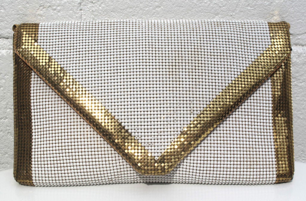 This is am amazing piece from the collaboration between Leo Narducci and Whitting and Davis. Simple in Shape, timeless. A White envelope clutch with Gold Trim. Strap is optional.<br />
<br />
---<br />
Leo Narducci<br />
Leo was born into the