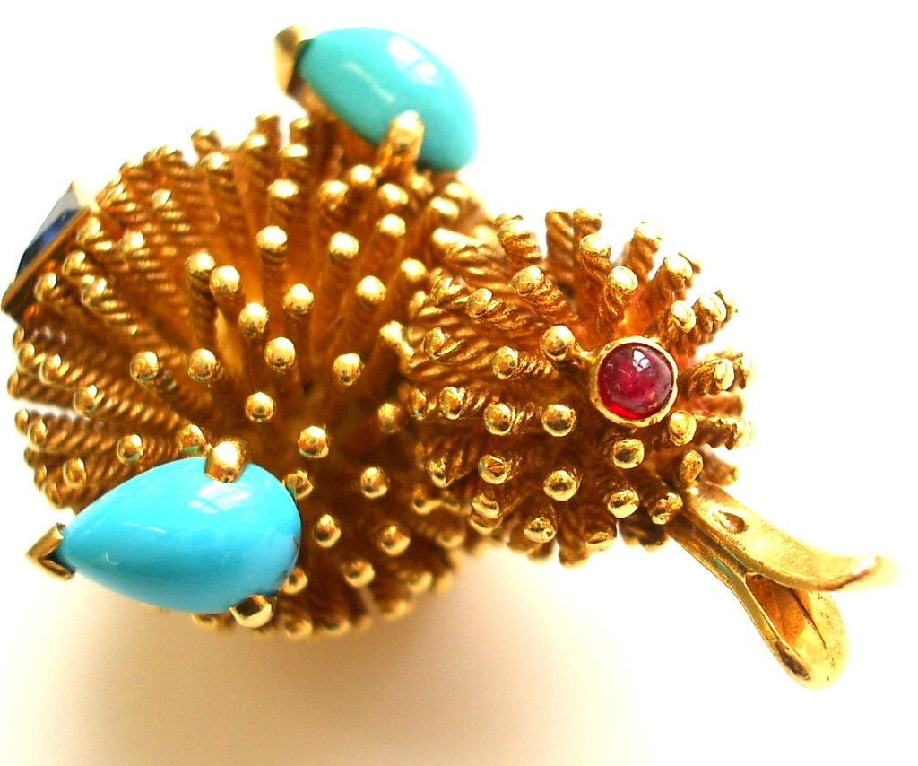 A charming 18k yellow gold,sapphire, ruby and turquoise scatter pin by Mauboussin.The 1 1/2