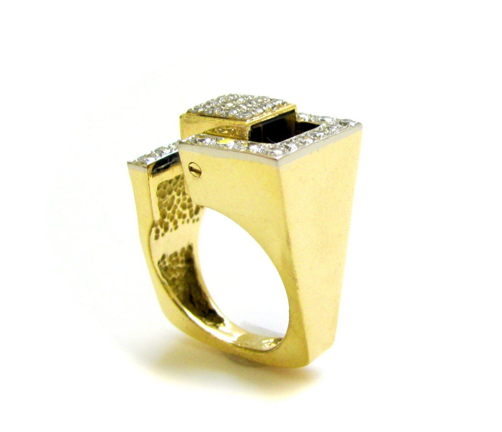 An interesting gold, lapis lazuli, malachite, tigers eye and diamond ring. The 3/4 x 5/8