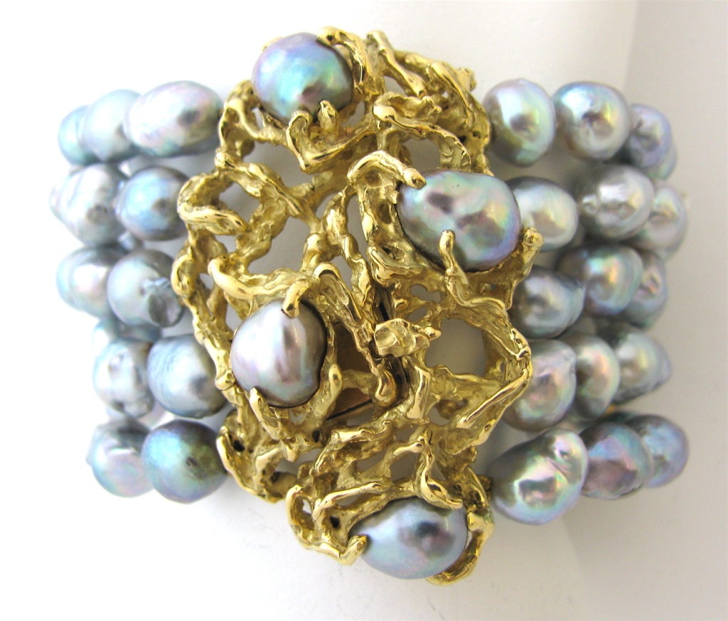 An attractive gold and pearl bracelet and ring attributed to Arthur King. The 2