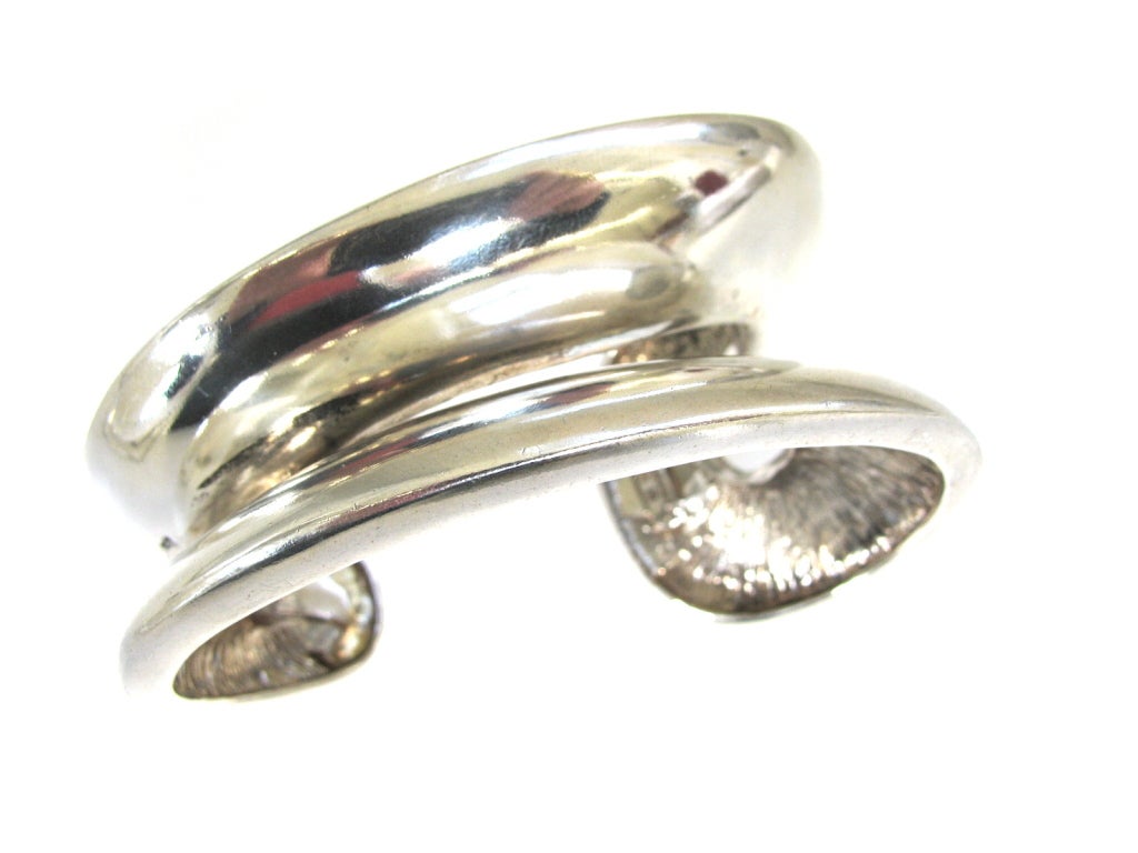 Takashi Wada (1938-)A modernist sterling bangle. An elliptical formed sterling silver bracelet tapering from 3/4