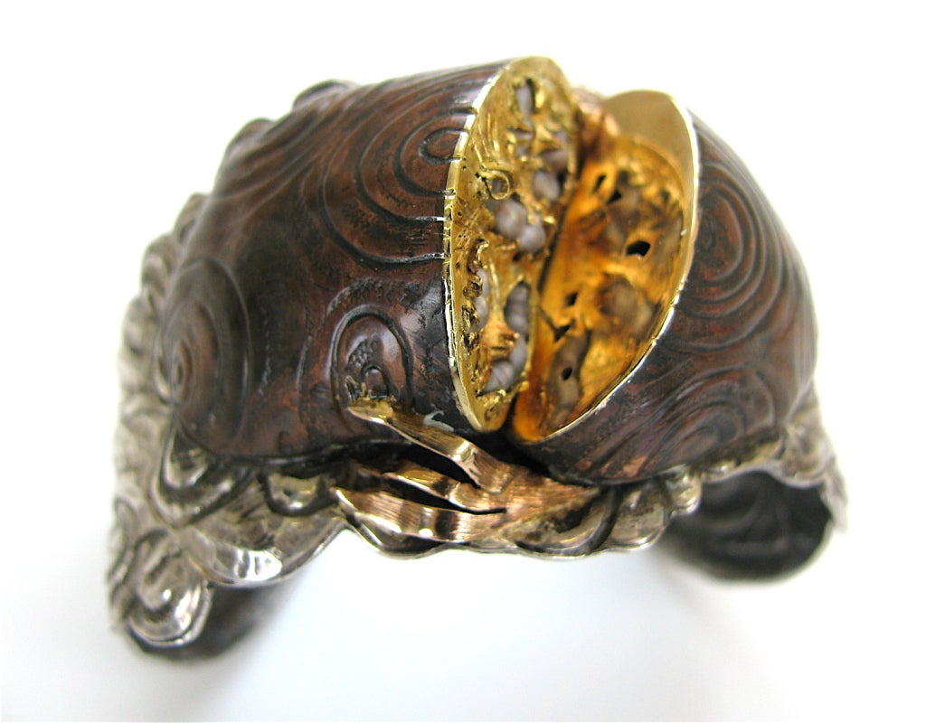 Margaret Barnaby, A sculptural sterling and gold bracelet. The 1 1/2