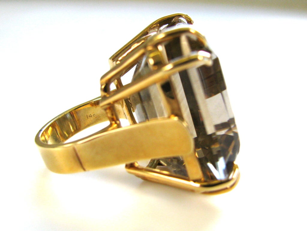 A handsome smoky quartz retro ring. The 14k yellow gold double pronged mount with a 1 1/8